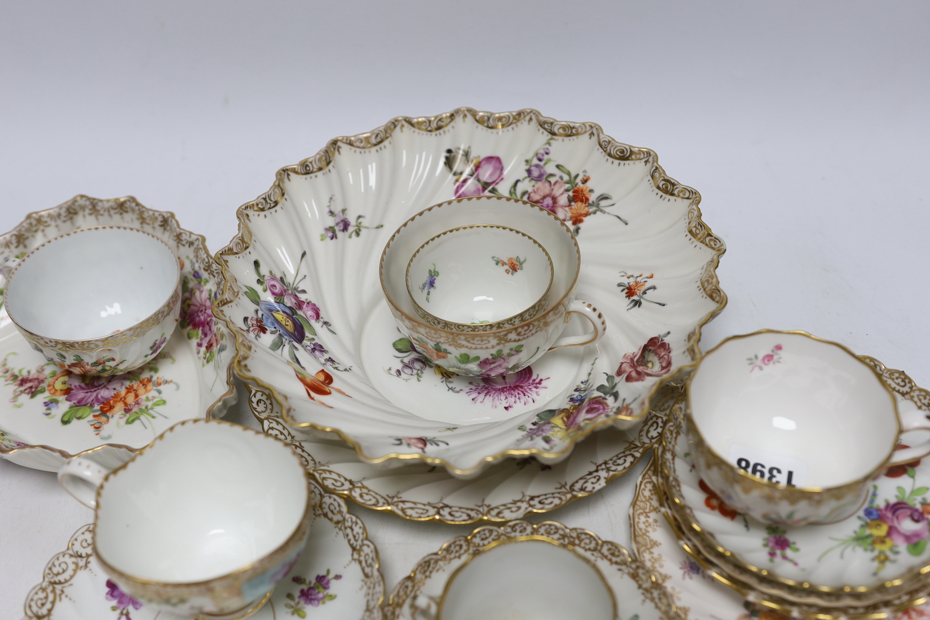 A group of Dresden porcelain floral tea wares, largest 24cm in diameter